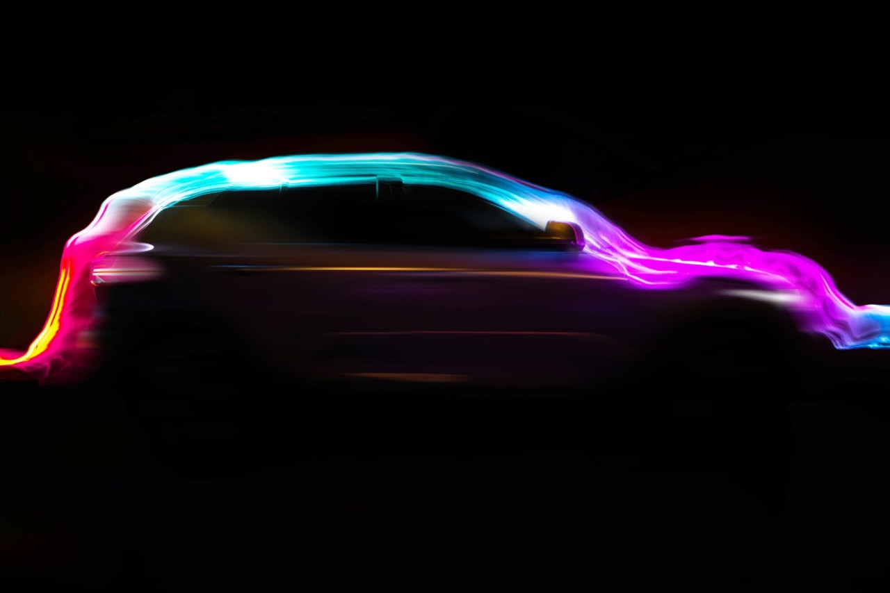 colorful-light-trail-flowing-over-modern-car-getty-1203366734